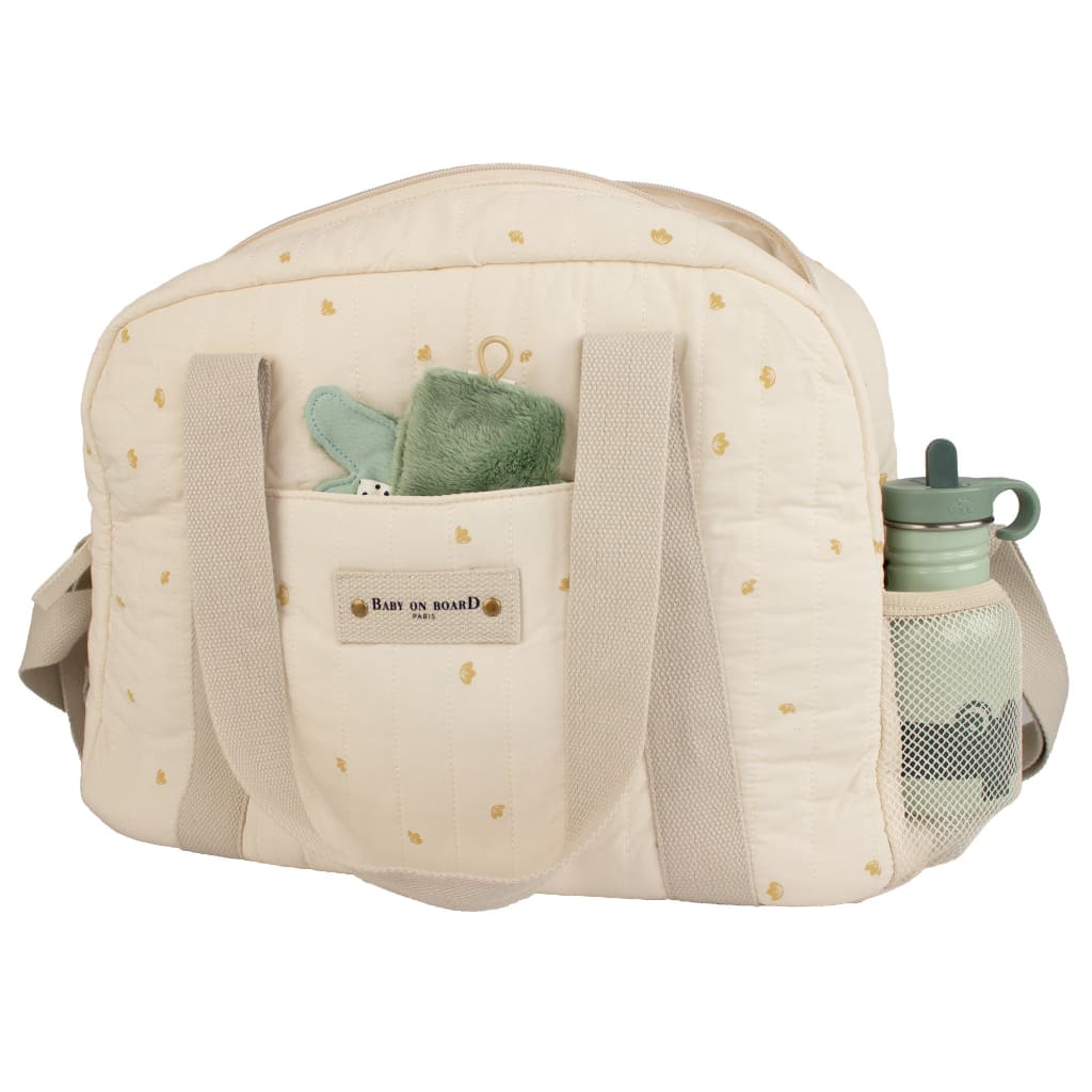 Sac à langer Simply Coton Baby on Board avec rangements latéraux pratiques, idéal pour garder les indispensables de bébé à portée de main.