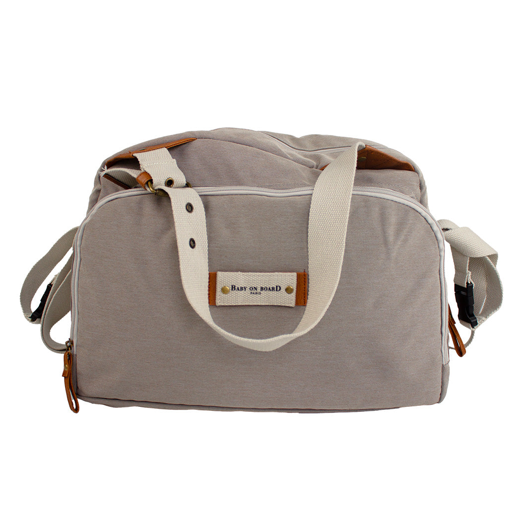 Sac à langer Titou Baby on Board beige, un design élégant et intemporel pour accompagner les sorties avec bébé.