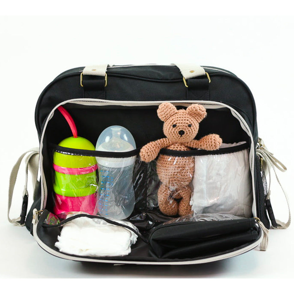 Intérieur du sac Simply Baby Bag avec compartiments de rangement et accessoires bébé.