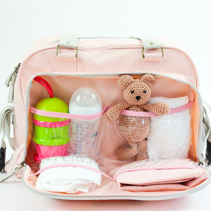 Intérieur du sac Simply Baby Bag Rose Vintage, organisé avec plusieurs compartiments et accessoires bébé.