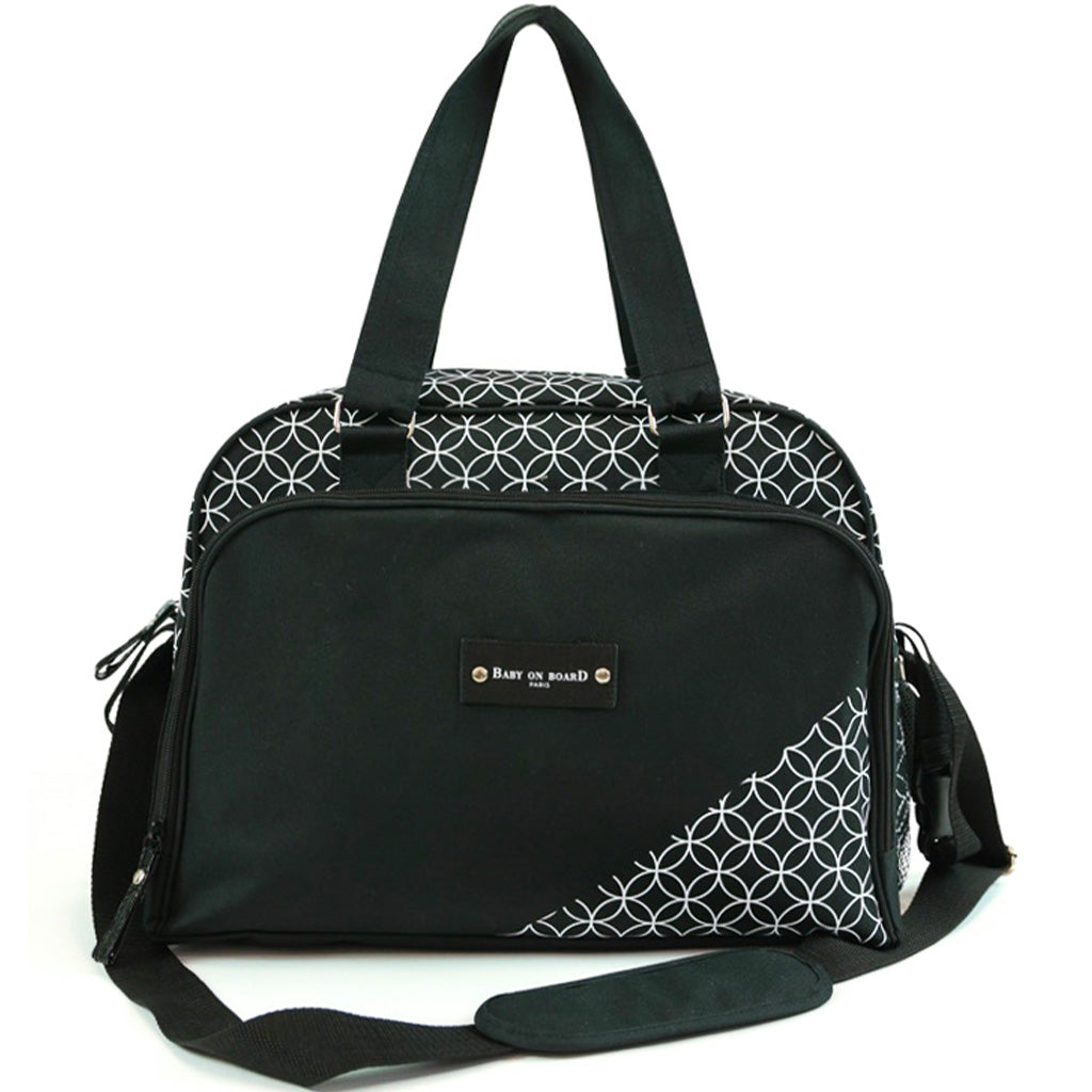 Sac à langer Simply Star noir avec motifs géométriques blancs, équipé d'une bandoulière et de poignées renforcées.